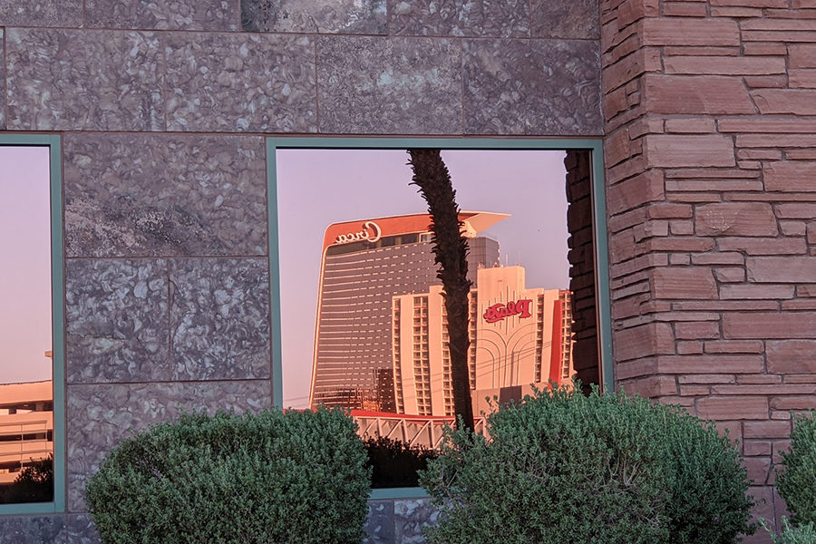 Las Vegas reflected in City Hall window.